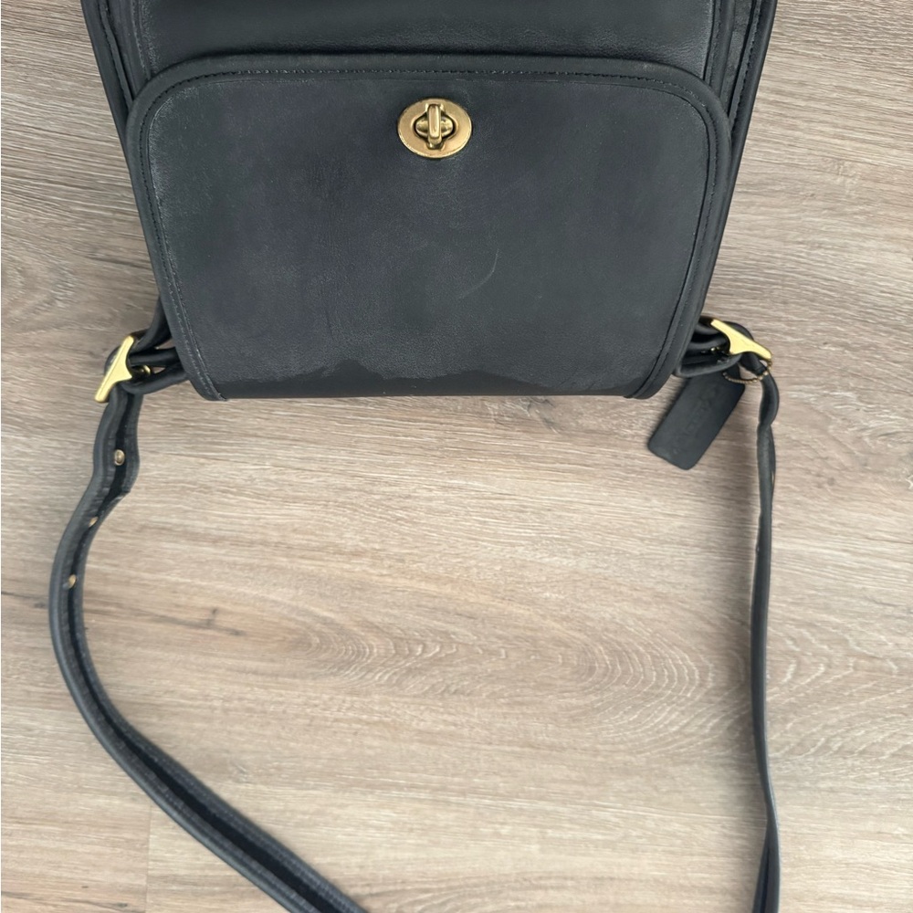 Elegant Black Leather Crossbody Bag with Gold Hardware